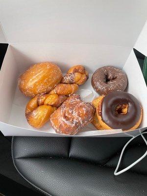 Jelly-filled, cinnamon twist, Apple fritter, chocolate iced, chocolate cake, & chocolate frosted cake