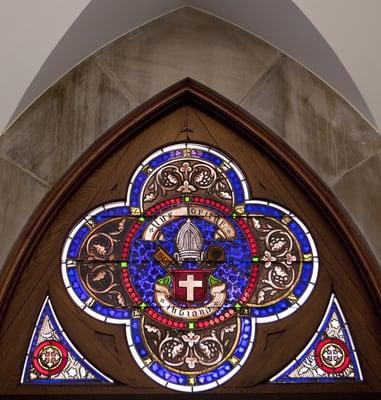 Stained glass above the Church's tower entrance doorway.