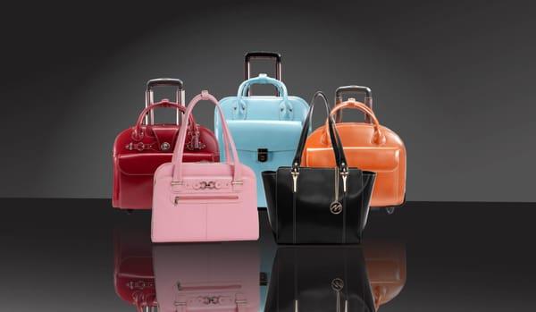 A Variety Of McKleinUSA's Wheeled Cases and Handbags