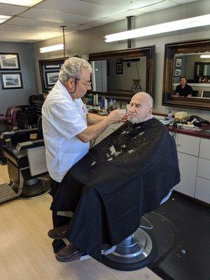 Master Barber Al expertly trim beards and cuts hair to your preference.