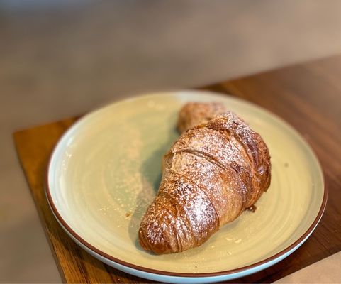 Butter croissant dusted with sugar.