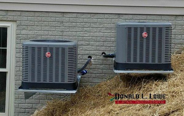 2 new Rheem units installed and lifted off the ground for a customer.