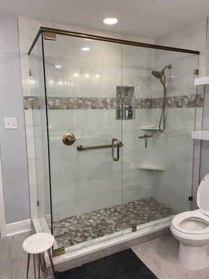 Shower Remodel with accent color of champagne bronze.