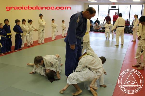 Kids learning self-defense and having a blast at Gracie Balance Academy!