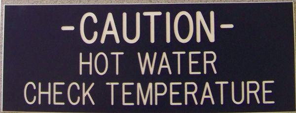 Engraving on a black/white wall plate warning sign.