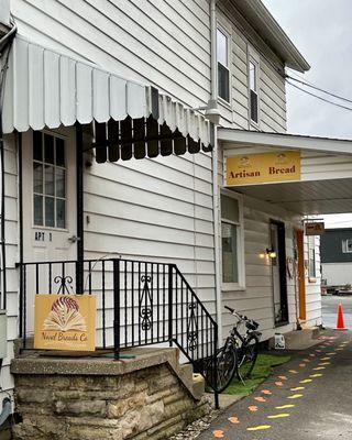 Entrance to store (follow the painted footprints)