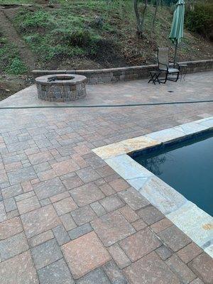 Ottocota pavers. Fire pit and 18 inch retaining wall.