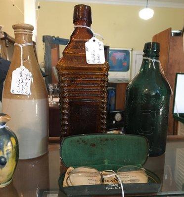 Old bottles and eyeglasses.