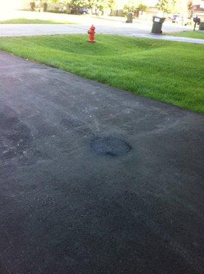 This is the "repair" to our driveway. Looks like a patch now.