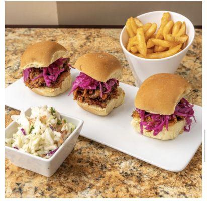 Brisket Sliders...

Smoked Brisket tossed in our House Made 50K BBQ Sauce and topped with Pickled Cabbage.