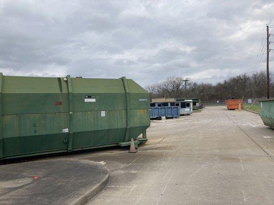 The dumpsters where you place the recycling. Sorted by paper/cardboard, glass, plastic