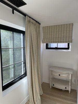 Custom roman shades and room darkening draperies with the same fabric.  Pacific palisades home