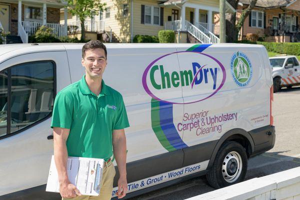 Chem-Dry tech standing next to a van holding a