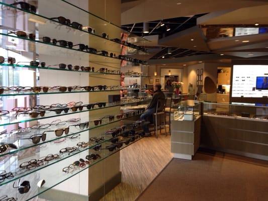 Large selection of designer frames in a casual shopping environment.