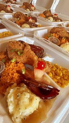 Red rice, pineapple glazed ham, mashed potato, fried chicken, tangy meatloaf, buttered corn.