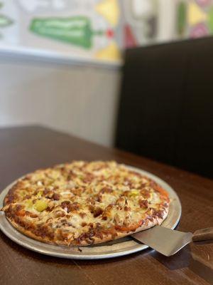 BBQ chicken pizza with added banana peppers. Totally recommend