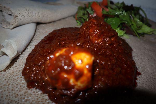 Derho Spicy- Popular traditional dish in both Ethiopia & Eritrea. Chicken stew cooked in a blend of spices & Special house sauce, serve