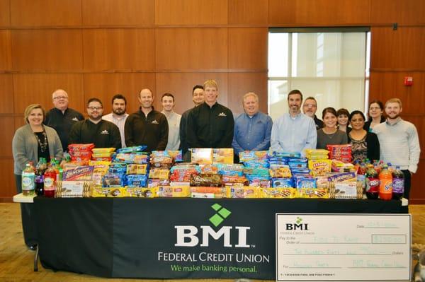 This year, BMI FCU staff donated 7,488 cookies, 28 two-liters of pop and $250 to Kids 'n Kamp for their annual holiday party.