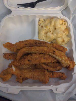 Cajun fish strips with Mac & cheese..... It's delicious.