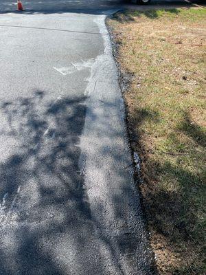 Spilled asphalt oil that wasn't cleaned up.