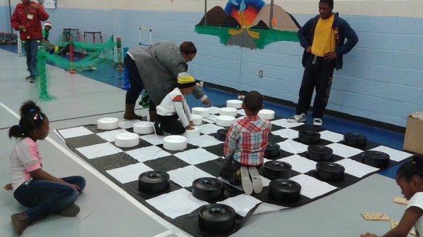 Using checkers to teach kids how to apply their STEM++ skills.