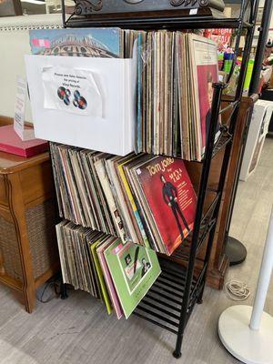 Lots of vinyl records, and a vintage record player for sale as well