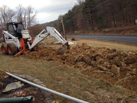 Trenching for drains and electric service installs