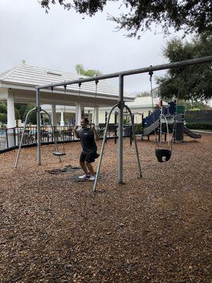 Playground with playing child.