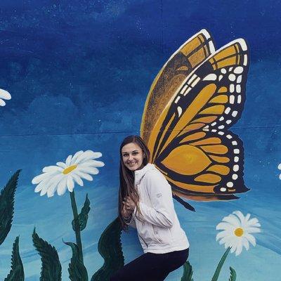 Standing in front of the mural I painted on market Street Bakery in Chehalis WA