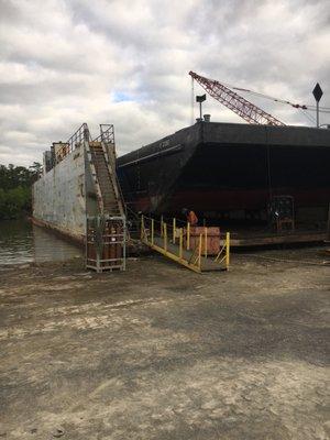 Barge on dry docking having rake knuckle repairs