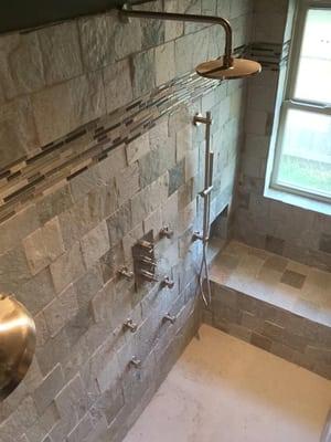 Removed a Tub and Shower Combo, Relocated drain lines to new location, installed a cultured marble shower pan, body shower ma...