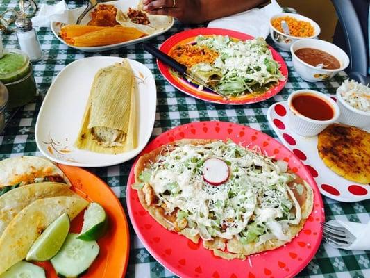 al pastor tacos. tamales. sope. enchiladas. beans and rice. pupusa. read my review.