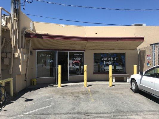 Side entrance to laundromat.   Parking on car wash side or street parking on broadway ave.