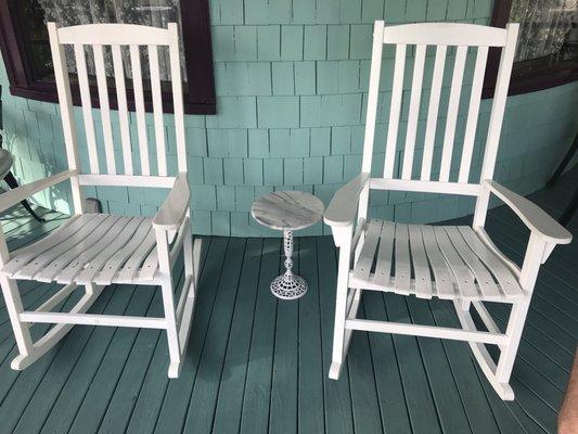 Front porch rocking chairs and a marble table