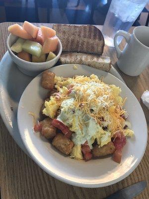 Tater tot skillet with a side of fruit