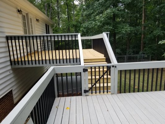 Deck restoration- New decking boards on upper deck, new hand railing on middle deck and new paint and stain on all 3 decks.