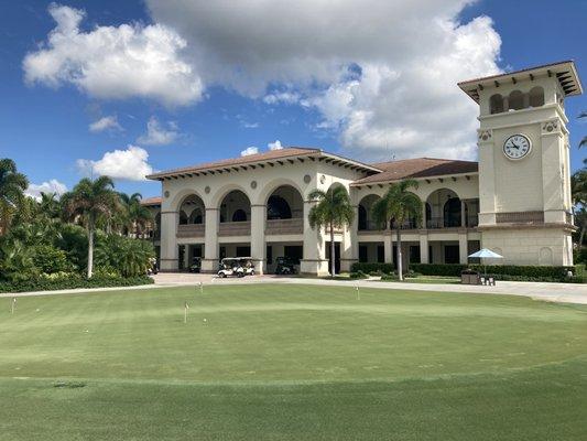 Golf shop entrance and practice putting green.