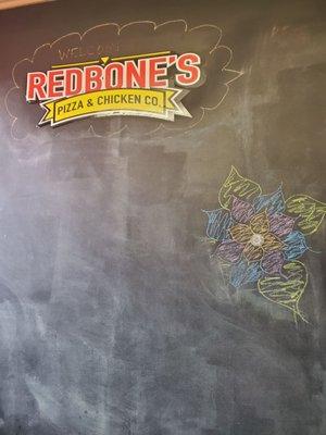 A chalkboard near the entrance