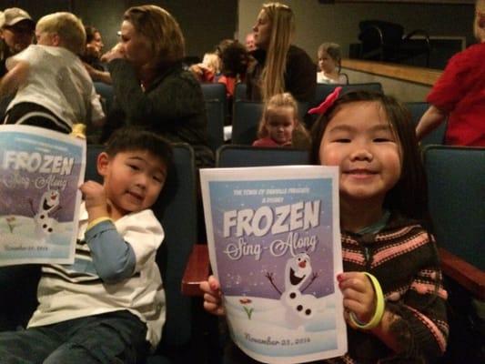 There are some very excited kids waiting for the Frozen Sing-a-long to start and The Village Theater!