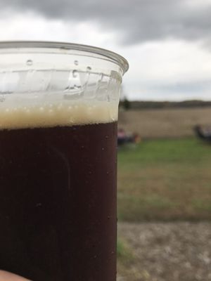 Drinking a spiced pumpkin beer on the rolling hills of Screaming Hills Brewery!