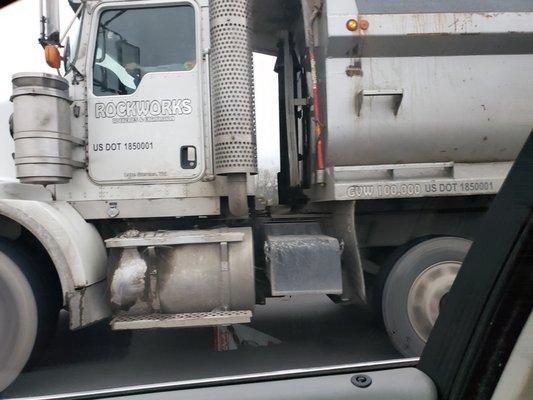 Rockworks truck dumping gravel on I5