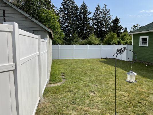 6' white vinyl fence.