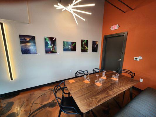 Tasting room with art show on wall