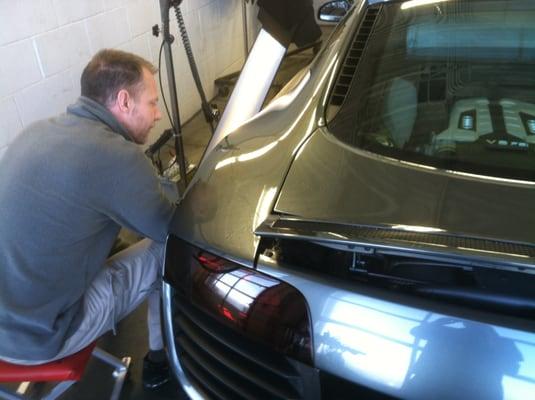 Barry repairing an Audi R8.