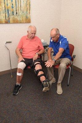 Therapist works with a patient as part of the home health care program.