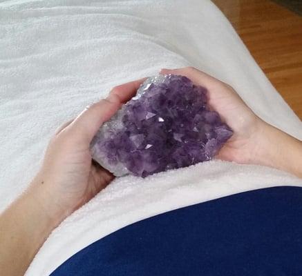 Reiki session incorporating Amethyst crystal energy.