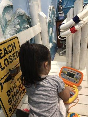 My daughter playing on the one of many toys available for her to use.