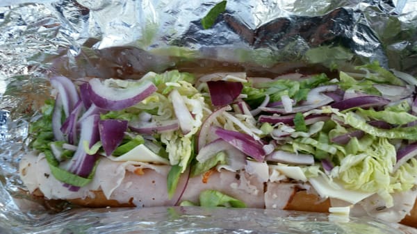 Turkey and cheese hoagie with lettuce, tomato and onion. It was good.