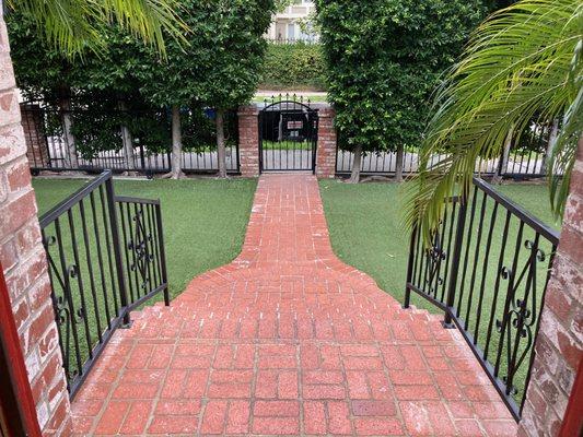 The front porch at our sober living in Los Angeles is a beautiful brick design   that leads to the front gate.