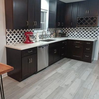 Unpack and set up client's kitchen in their new home!